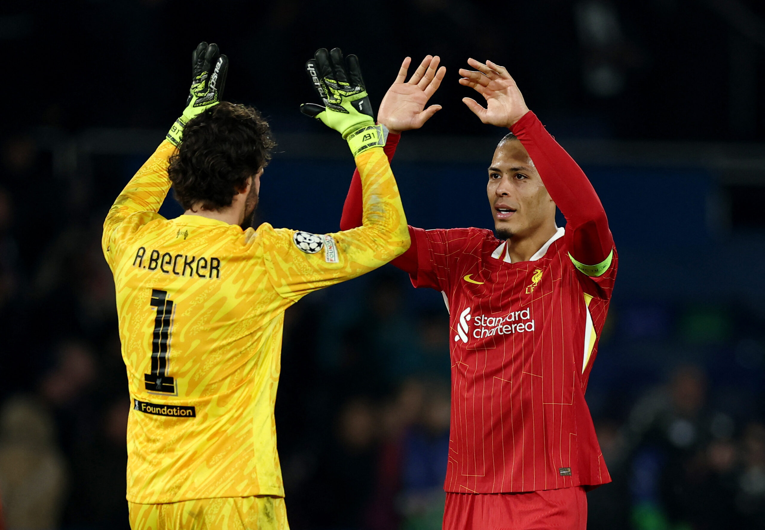 Alisson Becker i Virgil van Dijk/Foto REUTERS